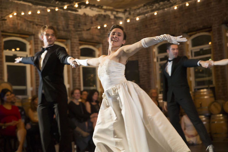Dancers performing in gowns tuxedos